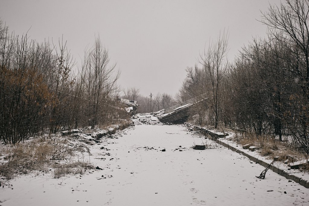 Road to nowhere near the destroyed airport, which now lies in the middle of the combat zone.